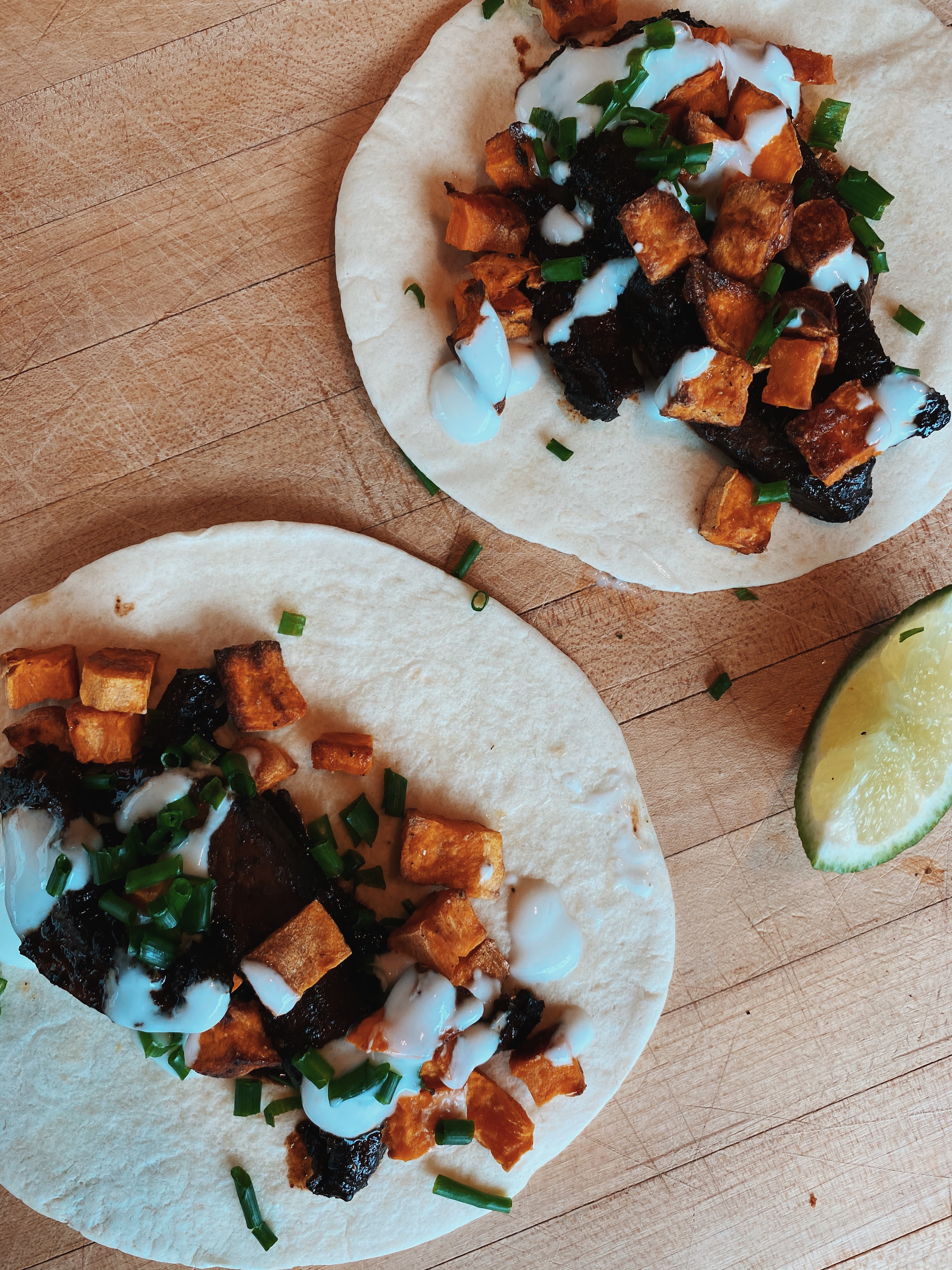 Mushrrom tacos on table fully assembled. Mushrrom tacos on table fully assembled.