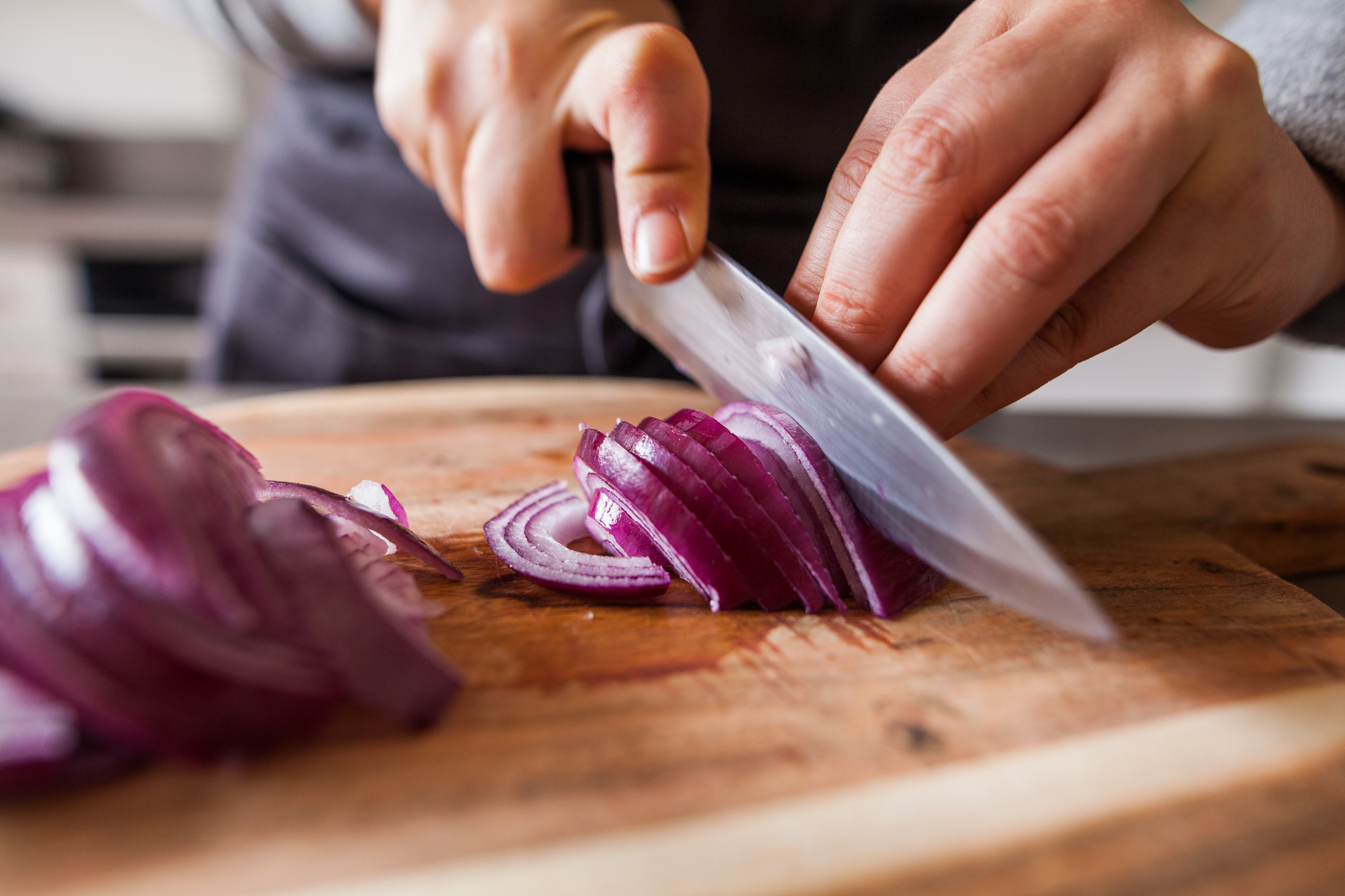 cutting onions on board