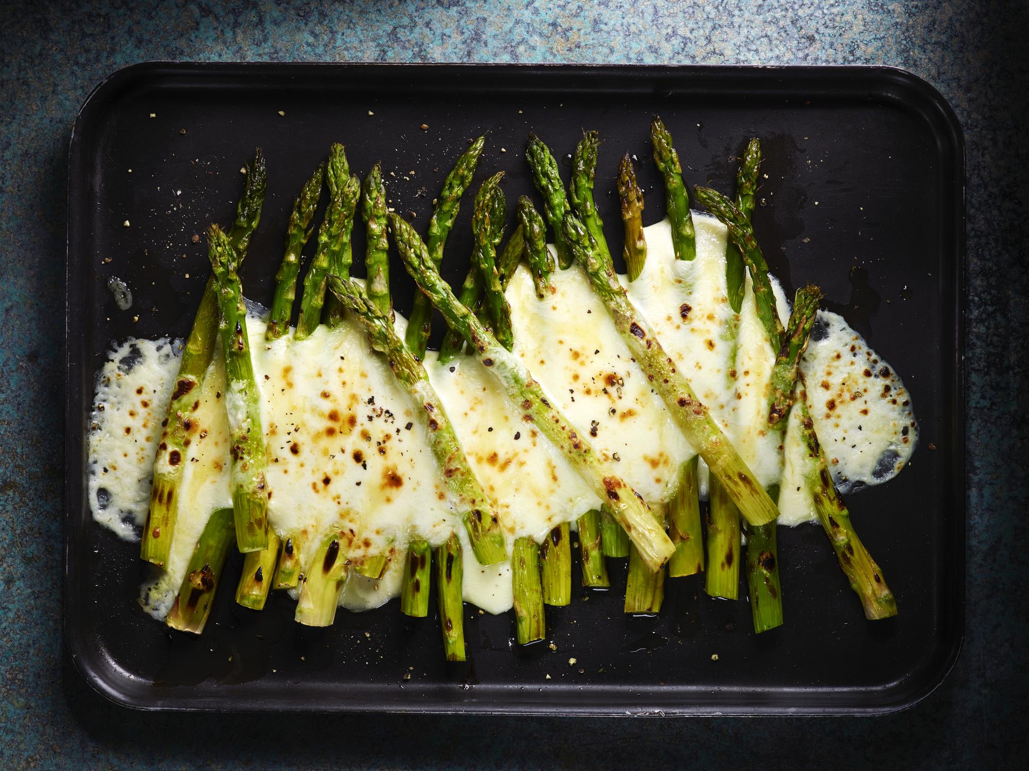 Cheesy asparagus on tray